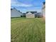 Expansive backyard featuring lush lawn and privacy fence perfect for outdoor activities and relaxation at 30 Wheat Dr, Angier, NC 27501