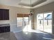 Cozy dining area with a stylish chandelier, sliding glass door, and natural light at 30 Wheat Dr, Angier, NC 27501