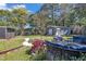 A paver path leads to a seating area in the spacious, landscaped backyard at 300 Lakeside Dr, Garner, NC 27529