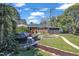 Charming backyard featuring a cozy patio area with comfortable seating, perfect for relaxing in the serene outdoor space at 300 Lakeside Dr, Garner, NC 27529