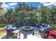 Backyard patio features outdoor seating around a fire pit beneath a vine-covered pergola at 300 Lakeside Dr, Garner, NC 27529