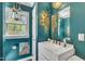 Stylish bathroom with unique wall decor, a modern vanity, and a sink at 300 Lakeside Dr, Garner, NC 27529