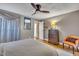 Bedroom with a ceiling fan, dresser, hardwood floors, and natural light at 300 Lakeside Dr, Garner, NC 27529
