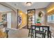 Open-concept dining room features a table with seating for four, decorative art, and an open doorway to another room at 300 Lakeside Dr, Garner, NC 27529