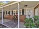 Cozy front porch features seating, a decorative rug, and a welcoming entrance at 300 Lakeside Dr, Garner, NC 27529