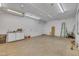 The large, open garage interior provides plenty of space for parking and storage at 300 Lakeside Dr, Garner, NC 27529