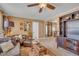 Inviting living room showcasing comfortable seating, an area rug, ceiling fan, and a doorway to another room at 300 Lakeside Dr, Garner, NC 27529