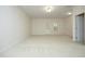 Unfinished basement with white carpet and access to the outside at 335 Bridgegate Dr, Cary, NC 27519