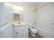 A full bathroom with white vanity, toilet, and shower-tub combo provides a clean, functional space at 335 Bridgegate Dr, Cary, NC 27519