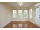 Dining room features three large windows and hardwood floors at 335 Bridgegate Dr, Cary, NC 27519