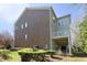 Side exterior elevation of home with brick and siding and walk out basement at 335 Bridgegate Dr, Cary, NC 27519