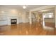 Spacious living room with hardwood floors, fireplace, built-in shelving, and neutral color palette at 335 Bridgegate Dr, Cary, NC 27519