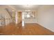 Open-concept space with hardwood floors connects the living and kitchen areas at 335 Bridgegate Dr, Cary, NC 27519