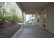 Patio view with nature views and the building exteriors in the distance at 335 Bridgegate Dr, Cary, NC 27519