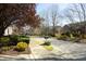Street view shows other homes and mature trees in the neighborhood at 335 Bridgegate Dr, Cary, NC 27519