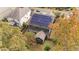 Aerial view of home with solar panels and fenced-in backyard at 3409 Lily Orchard Way, Apex, NC 27539