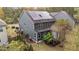 Aerial view of a gray home featuring solar panels and fenced-in backyard at 3409 Lily Orchard Way, Apex, NC 27539
