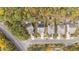 Aerial view of neighborhood showcasing home and landscape in autumn at 3409 Lily Orchard Way, Apex, NC 27539