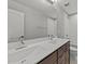 Bathroom with double vanity, ample lighting, and a shower-tub combo at 3409 Lily Orchard Way, Apex, NC 27539