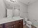 Bathroom featuring a vanity with a single sink and a separate toilet and shower at 3409 Lily Orchard Way, Apex, NC 27539