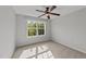 Bedroom with neutral walls, large window, ceiling fan and natural light at 3409 Lily Orchard Way, Apex, NC 27539