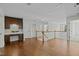 Loft featuring a desk and storage, with wood floors and a view of the staircase at 3409 Lily Orchard Way, Apex, NC 27539