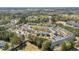 Aerial view of townhome community with mature trees and landscaping at 4011 Volkswalk Pl, Raleigh, NC 27610