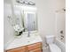 Bright bathroom with updated vanity, contemporary fixtures and relaxing shower-tub combo at 4011 Volkswalk Pl, Raleigh, NC 27610