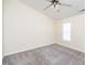 This spacious bedroom offers neutral walls, soft carpeting, and a bright window at 4011 Volkswalk Pl, Raleigh, NC 27610