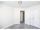Inviting bedroom offers neutral paint, soft carpet, and convenient double door closet at 4011 Volkswalk Pl, Raleigh, NC 27610