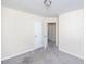 Cozy bedroom featuring gray carpet, a ceiling light and access to two closets at 4011 Volkswalk Pl, Raleigh, NC 27610
