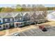 Exterior view of townhomes with well-maintained landscaping and parking at 4011 Volkswalk Pl, Raleigh, NC 27610