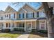 Attractive townhome with a quaint front porch and lovely architectural details at 4011 Volkswalk Pl, Raleigh, NC 27610