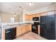 Well-equipped kitchen with modern appliances and light wood cabinetry at 4011 Volkswalk Pl, Raleigh, NC 27610