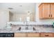 Close-up of the kitchen sink area featuring granite countertops and modern faucet at 4011 Volkswalk Pl, Raleigh, NC 27610