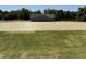 Lush backyard with sod being installed offers a blend of new growth and mature green grass at 4013 Kingcraig Ln, Zebulon, NC 27597
