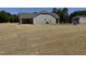 A newly constructed home features sod being installed in the expansive backyard at 4013 Kingcraig Ln, Zebulon, NC 27597