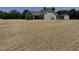 New home with a sprawling backyard featuring freshly installed sod for a lush, green lawn at 4013 Kingcraig Ln, Zebulon, NC 27597