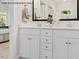 Elegant bathroom with double vanities, sleek fixtures, and ample storage in a well-lit space at 4013 Kingcraig Ln, Zebulon, NC 27597