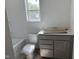 Bathroom featuring a bathtub, vanity, and toilet area with natural light at 4013 Kingcraig Ln, Zebulon, NC 27597