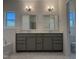 Bathroom featuring double sink vanity, marble floors, and a large window at 4013 Kingcraig Ln, Zebulon, NC 27597
