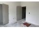 Bedroom featuring neutral gray walls and multiple doorways at 4013 Kingcraig Ln, Zebulon, NC 27597