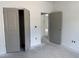 Bedroom with large closet and doorways; freshly painted gray at 4013 Kingcraig Ln, Zebulon, NC 27597