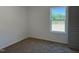 Bedroom featuring carpet, neutral paint, and natural light from a large window at 4013 Kingcraig Ln, Zebulon, NC 27597