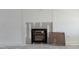 Modern fireplace with a white shiplap surround awaiting finishing touches at 4013 Kingcraig Ln, Zebulon, NC 27597