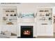 Cozy fireplace framed by built-in shelves, offering ample storage and display space in the living room at 4013 Kingcraig Ln, Zebulon, NC 27597