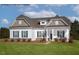 Charming single-story home with blue shutters, covered entry and well manicured lawn at 4013 Kingcraig Ln, Zebulon, NC 27597