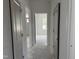 Hallway shows access to rooms with large windows for great light at 4013 Kingcraig Ln, Zebulon, NC 27597