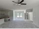 Open-concept living space with kitchen view and large windows at 4013 Kingcraig Ln, Zebulon, NC 27597