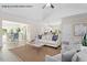 Open-concept living room with neutral tones, stylish furnishings, and seamless flow to dining at 4013 Kingcraig Ln, Zebulon, NC 27597